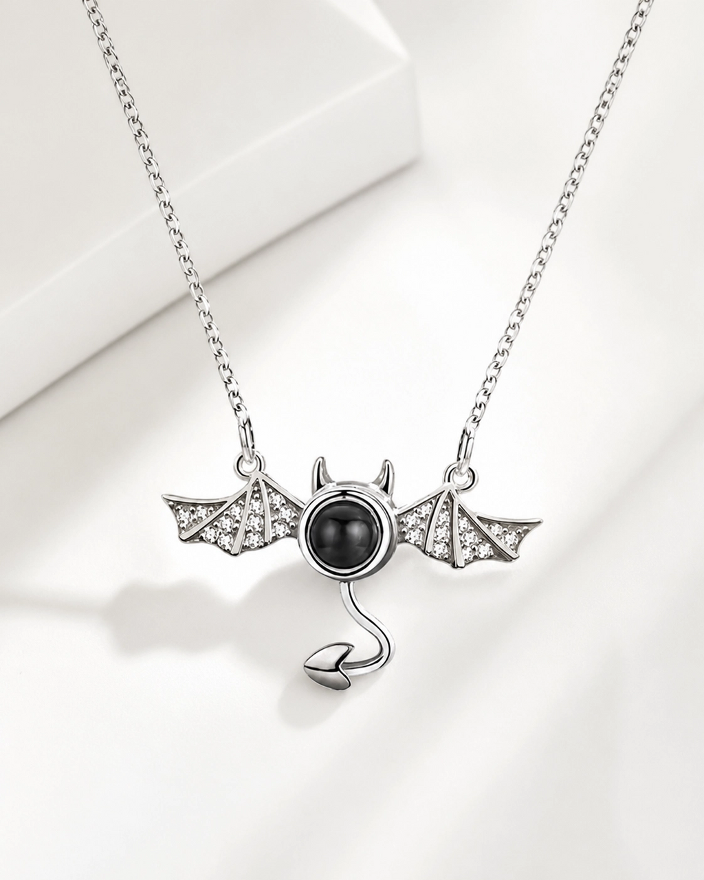 Little Devil photo projection necklace hanging