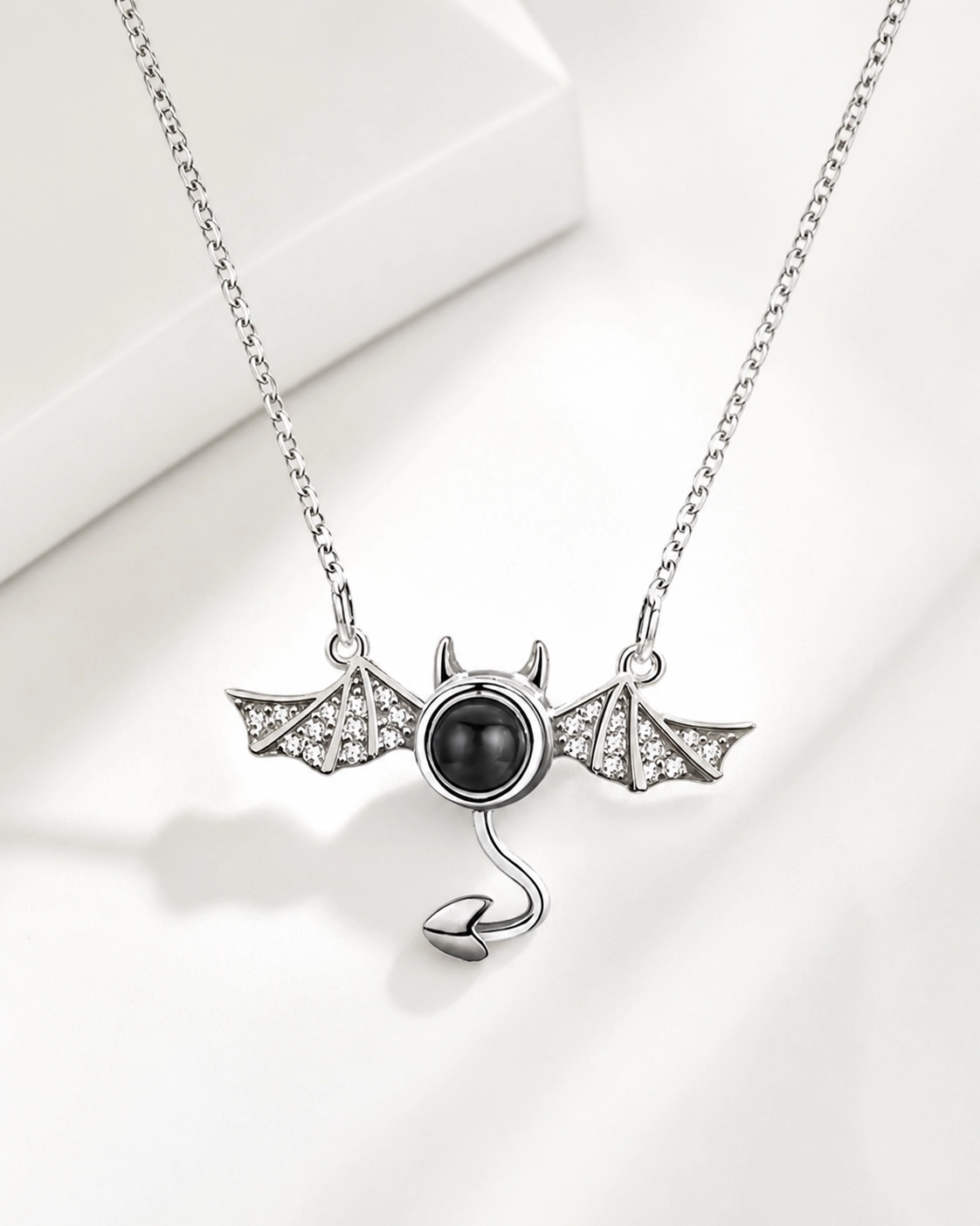 Little Devil photo projection necklace hanging